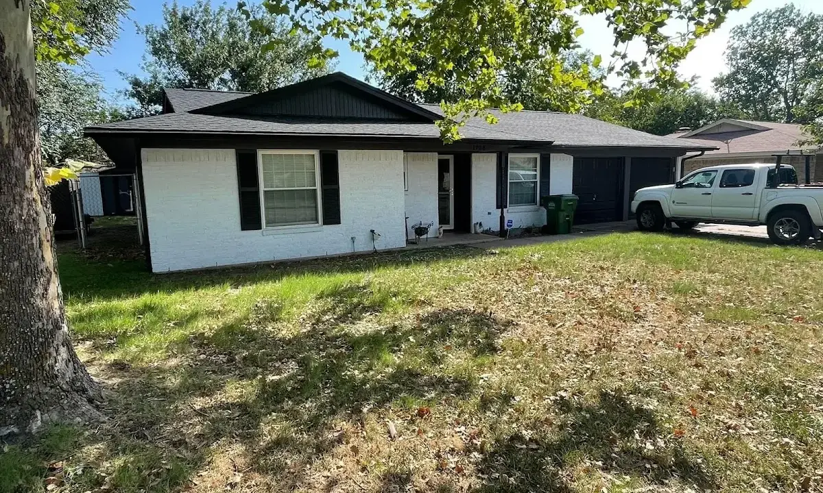 Professional roofing crew working on a residential roof in Satellite Beach